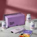 A product bundle display for GleeFull Supplements on a marble surface against a red background. The layout includes a large purple shipping box featuring the slogan 'FEEL LIKE YOURSELF AGAIN.', three white bottles of Carb Blocker, a purple branded pen, a matching notepad that reads 'REMINDERS WHEN I'M HAVING A MENOPAUSE MOMENT', and a recipe booklet titled 'THE MENOPAUSE Recipes'