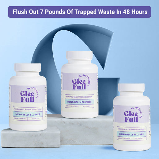 Product display for GleeFull Meno Belly Flusher dietary supplement. A purple banner across the top reads: 'Flush Out 7 Pounds Of Trapped Waste In 48 Hours'. Three white bottles with purple and cream labels are arranged on grey marble blocks against a blue background with a large blue letter G graphic. Each label reads 'GleeFull Supplements, Maintains Bloat Free Midsection, Meno Belly Flusher, Dietary Supplement, 60 Capsules'.